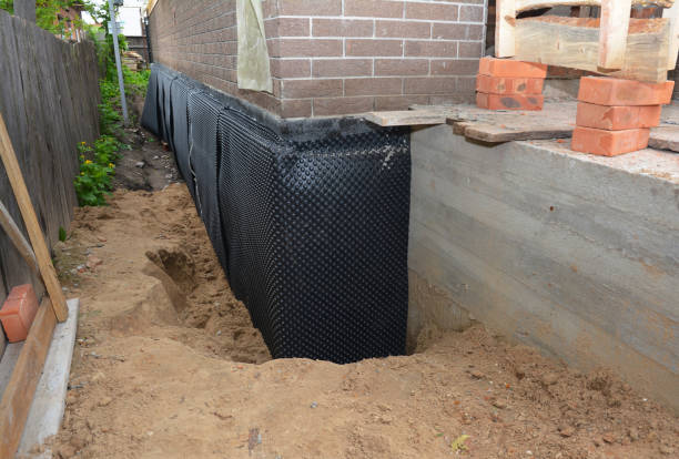 SJ Waterproofing Pros technician performing targeted Basement Waterproofing assessment in Auburntown, TN
